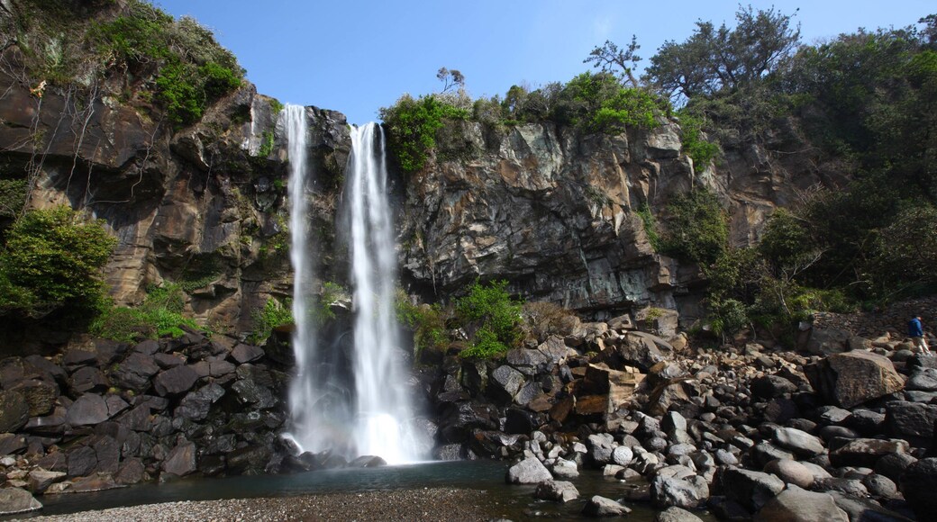 Jeongbang Waterfall featuring a gorge or canyon and a waterfall