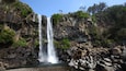 Jeongbang Waterfall featuring a gorge or canyon and a waterfall