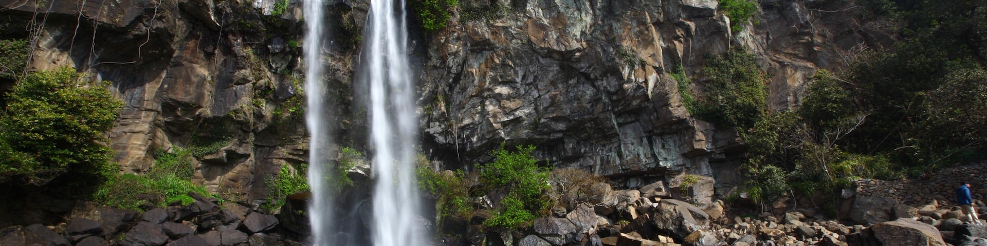 Jeongbang Waterfall featuring a gorge or canyon and a waterfall