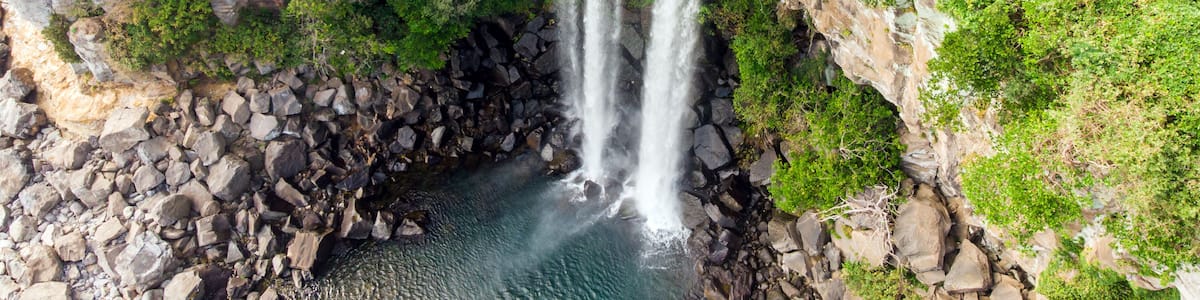 Aerial View of The High Waterfall Jeongbang and Lagoon on Jeju Island