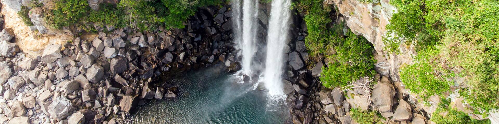 Aerial View of The High Waterfall Jeongbang and Lagoon on Jeju Island