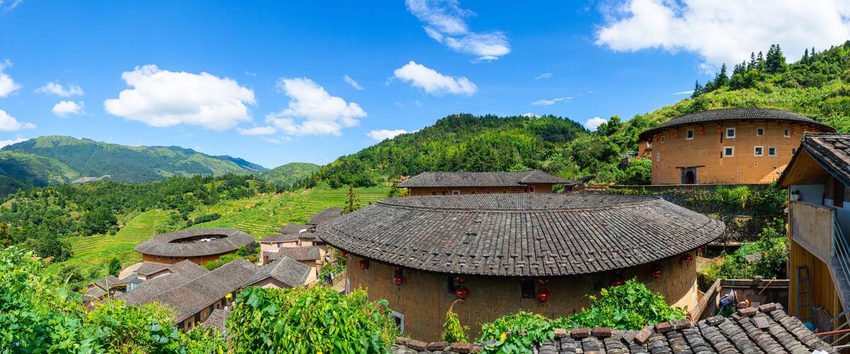 A traditional village with terraced fields and round-roofed buildings.