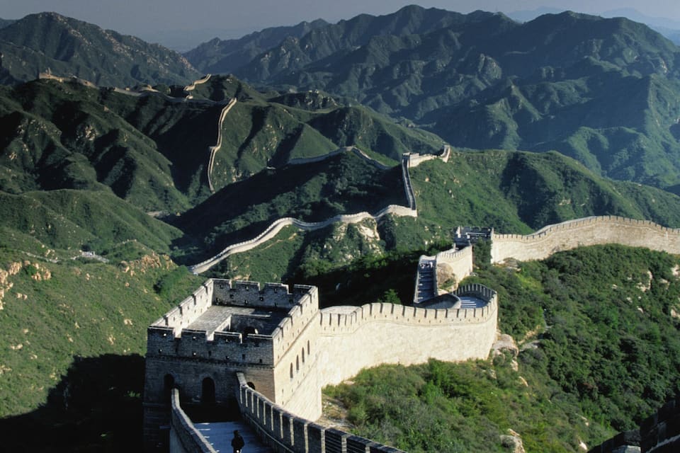 The Great Wall of China winding through mountainous terrain.