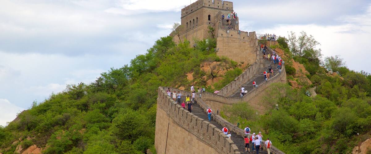 Beijing featuring a monument and heritage elements as well as a large group of people