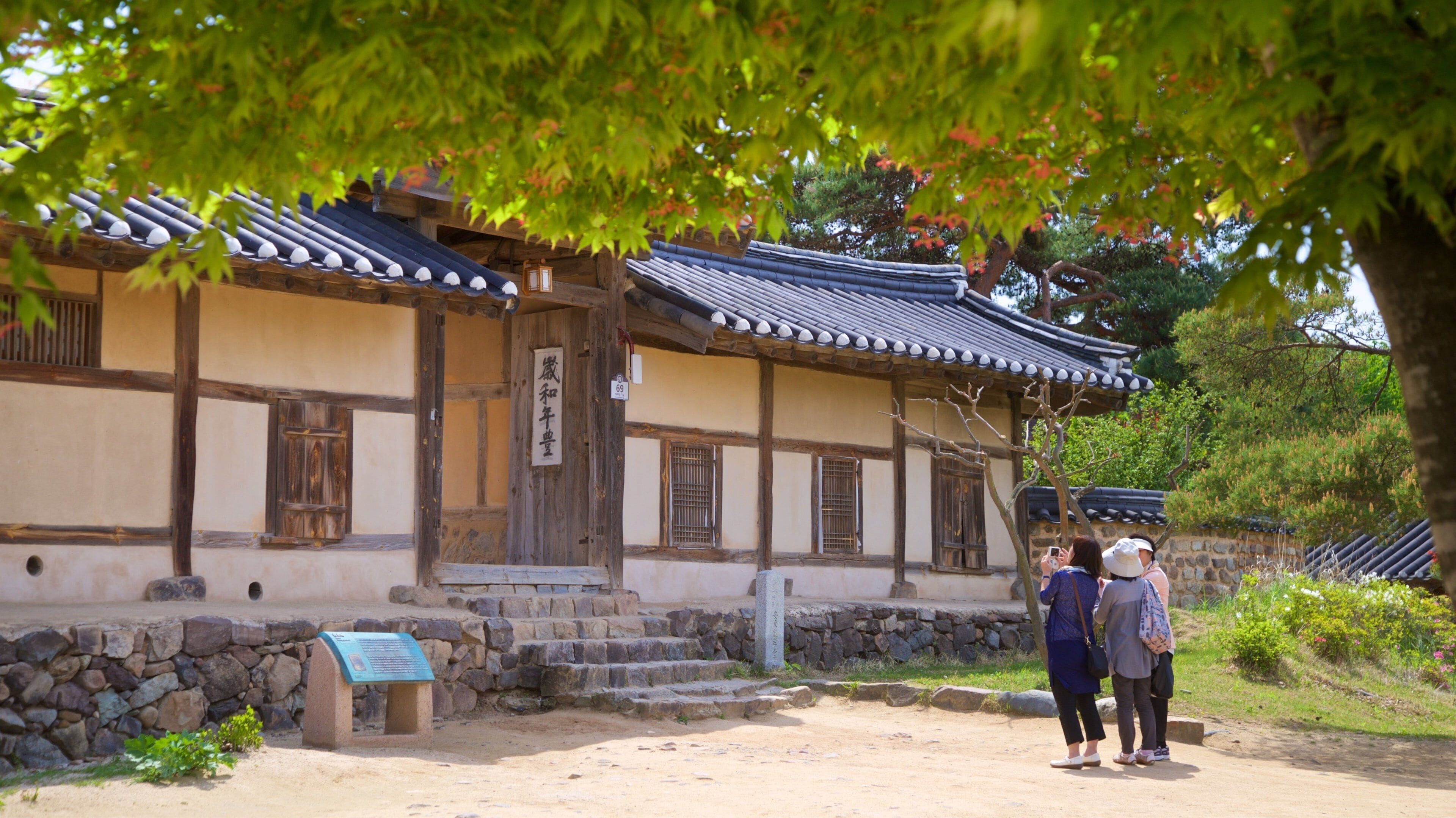 A traditional Japanese building with a tiled roof and wooden walls.