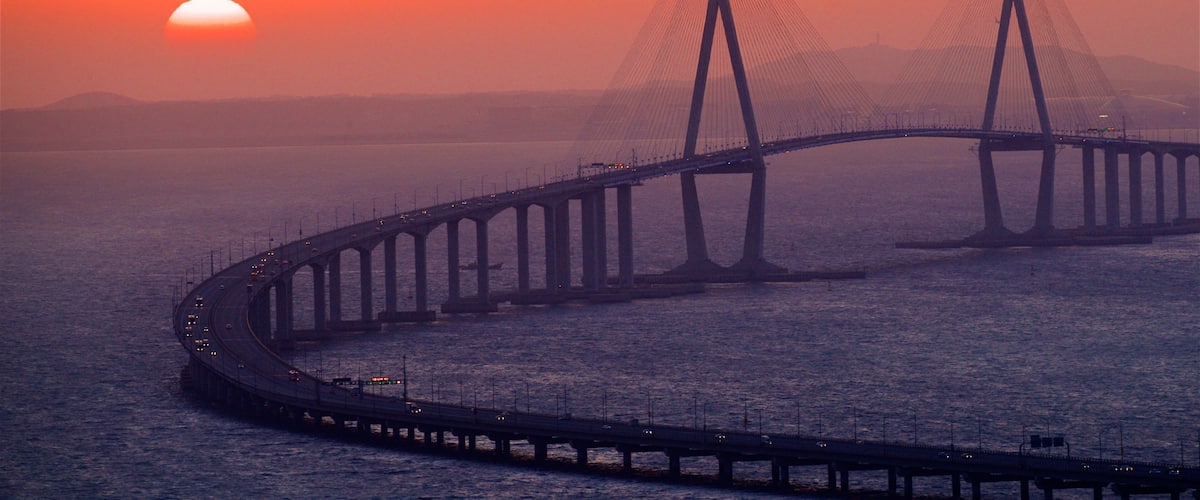 Incheon Bridge which includes landscape views, a sunset and a bridge