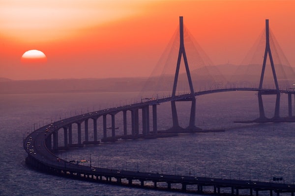 Incheon Bridge showing a sunset, a bridge and landscape views