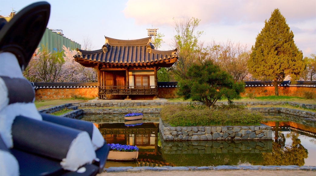Wolmi Traditional Park which includes a park, a pond and a sunset