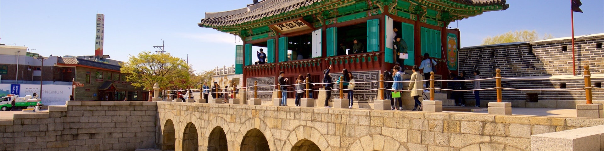 Hwahongmun Gate showing a river or creek, a bridge and heritage architecture