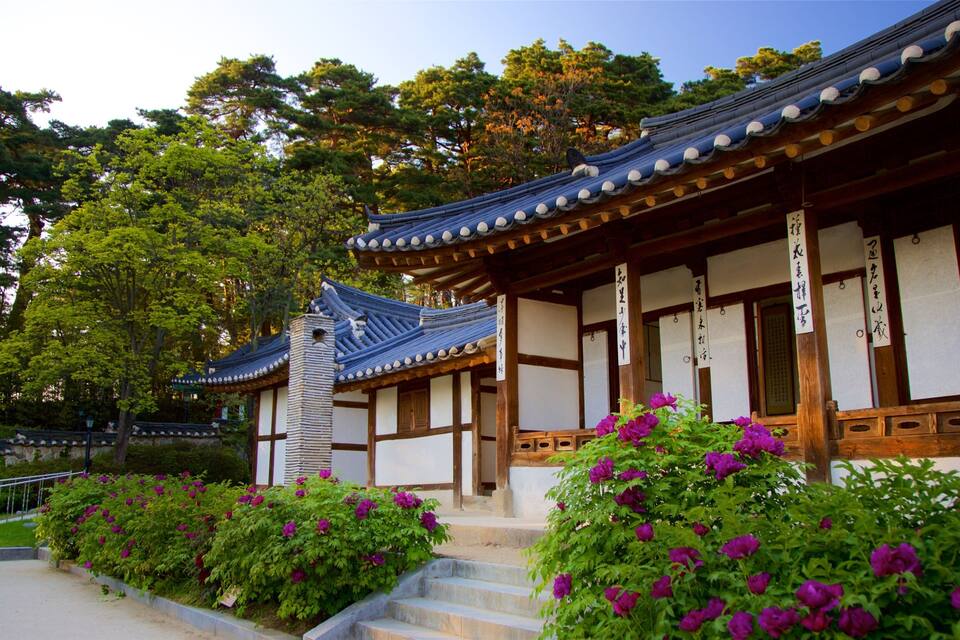 A traditional Japanese building with a tiled roof and wooden beams.