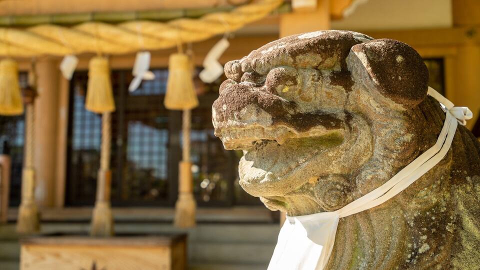 Tatsuta Shrine featuring heritage elements and a statue or sculpture