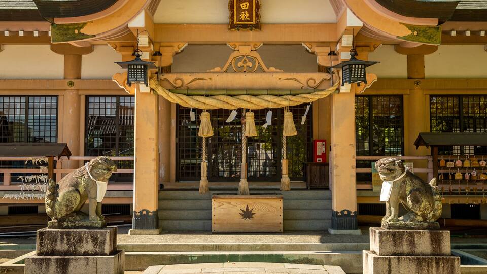 Tatsuta Shrine which includes a statue or sculpture, heritage elements and a temple or place of worship