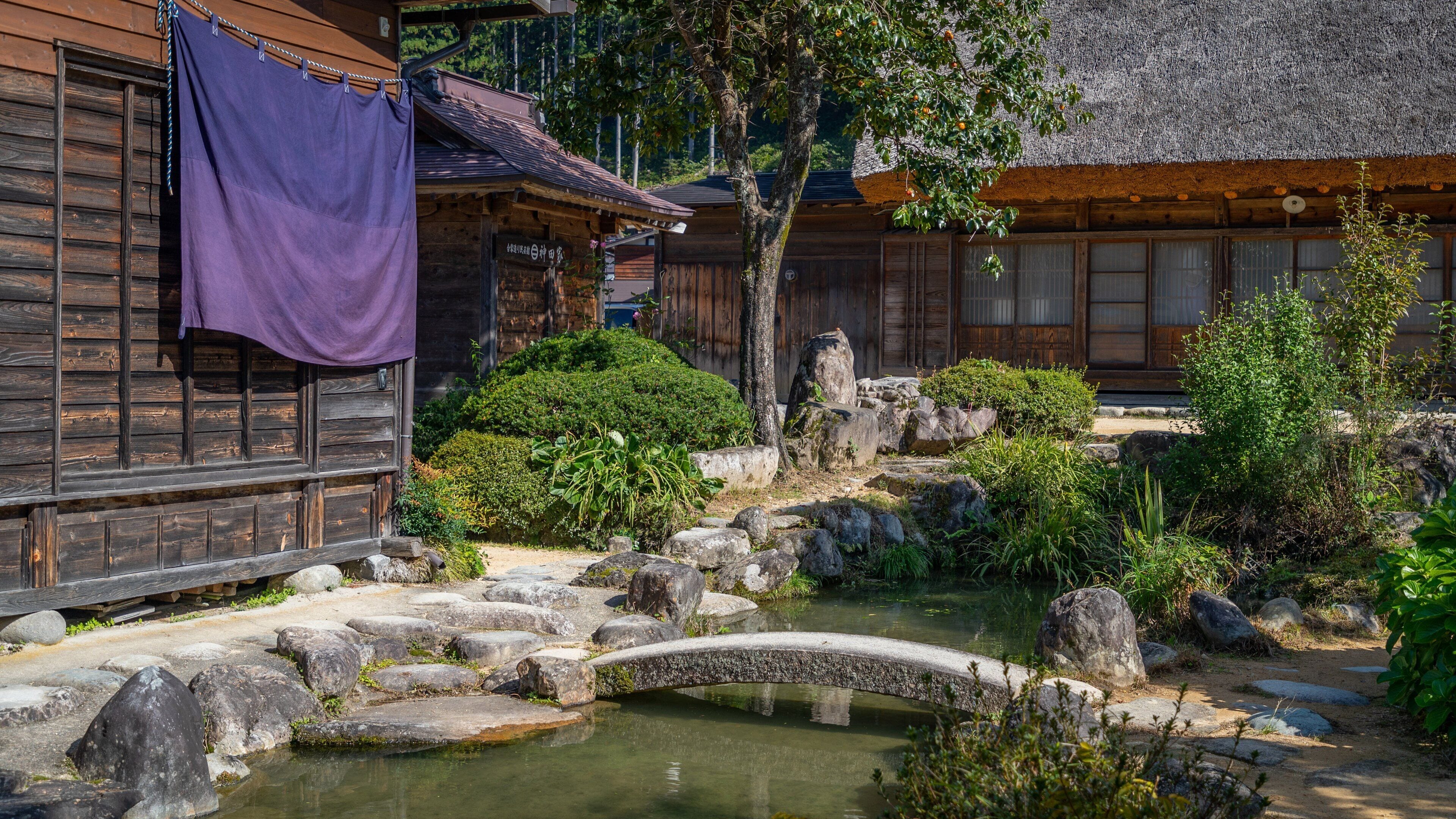 Kanda house showing a pond and a garden