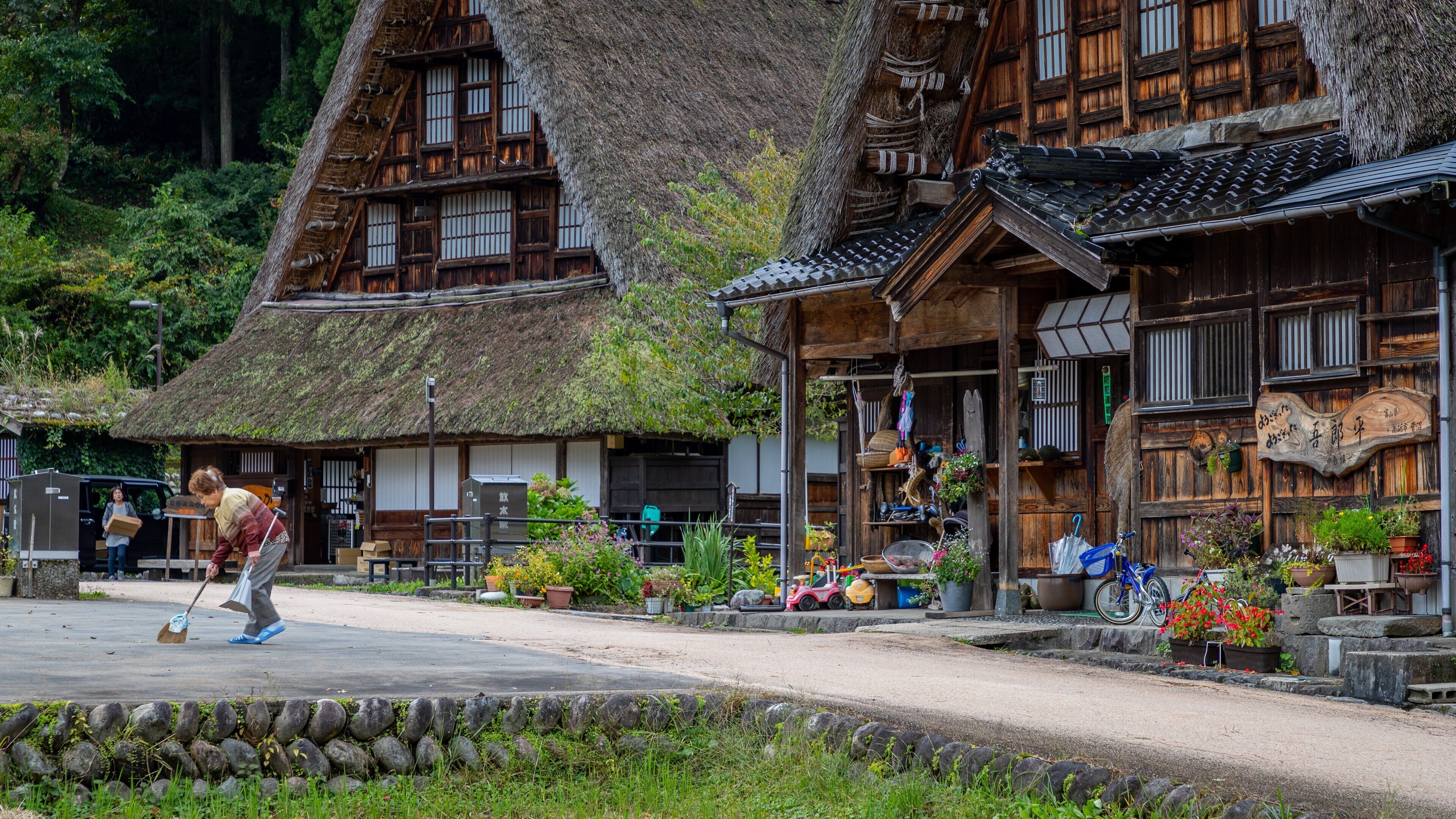 Nanto which includes a small town or village and street scenes as well as an individual femail