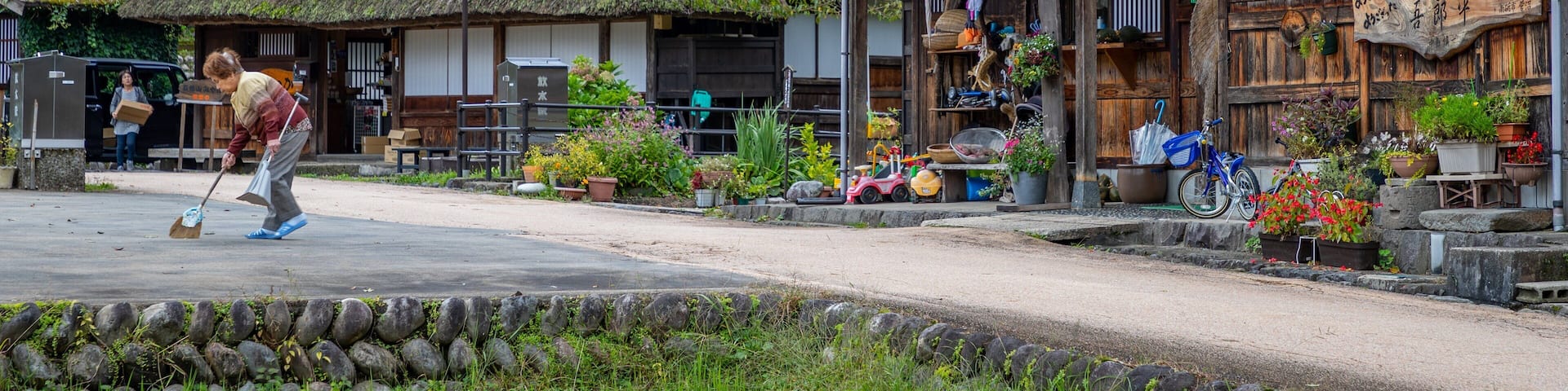 Nanto which includes a small town or village and street scenes as well as an individual femail