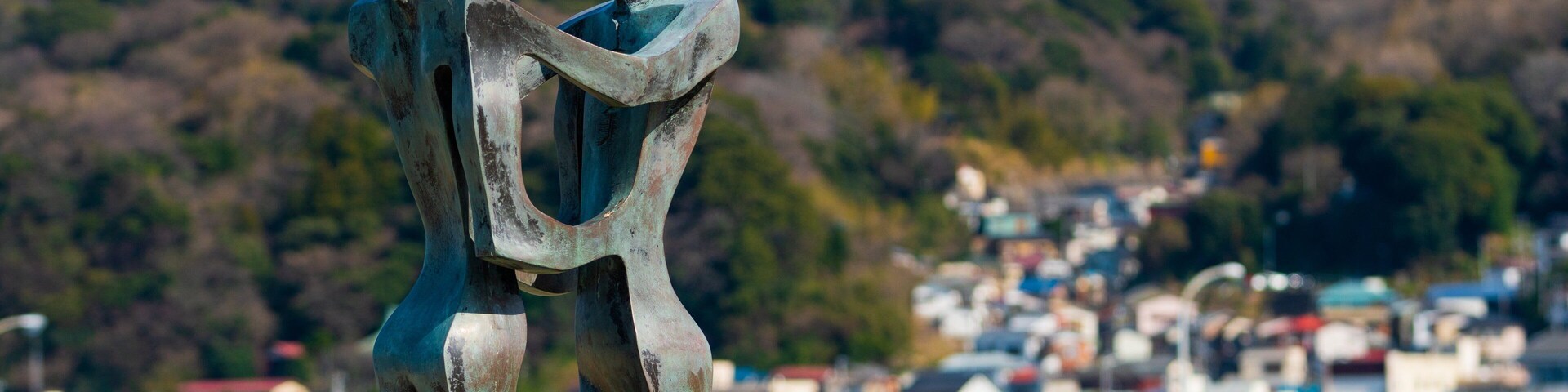Nagisa Park showing outdoor art and a bay or harbor
