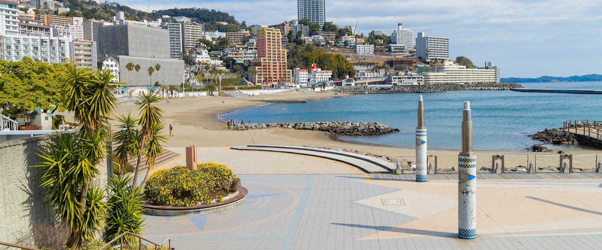 Atami Sun Beach showing a coastal town, general coastal views and a beach