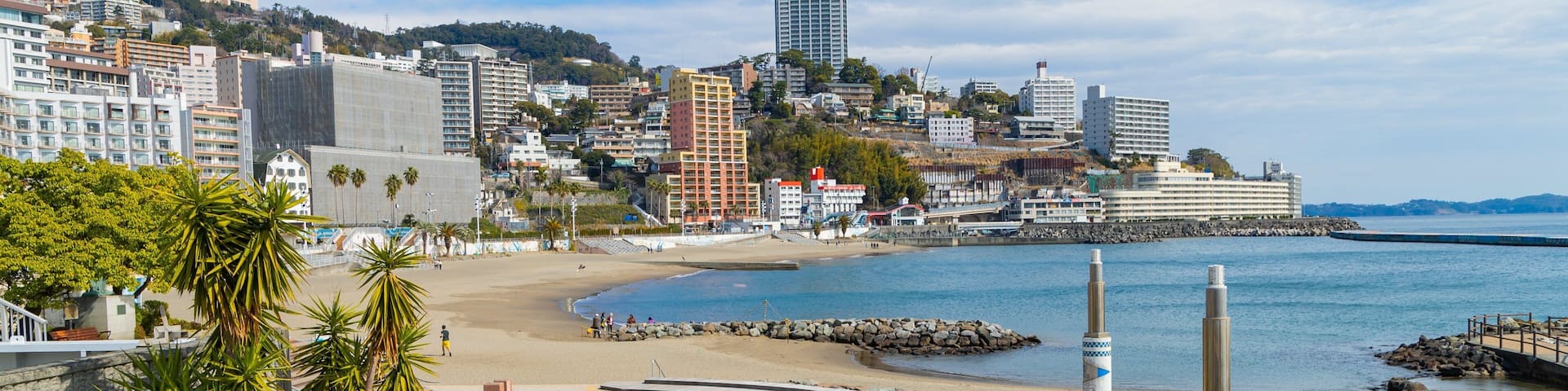 Atami Sun Beach showing a coastal town, general coastal views and a beach