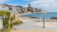 Atami Sun Beach showing a coastal town, general coastal views and a beach