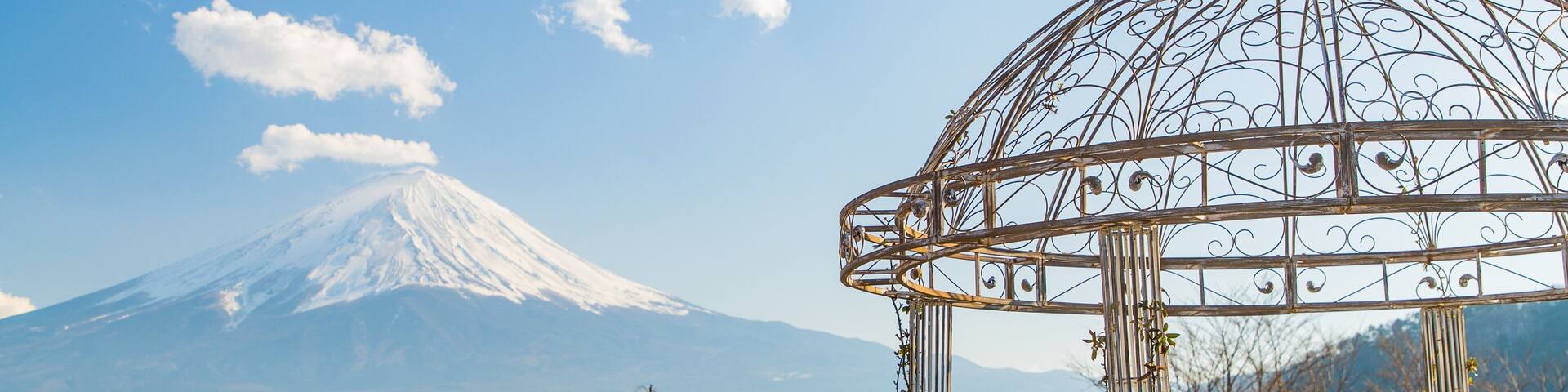Kawaguchiko Natural Living Center showing a lake or waterhole, a sunset and a park