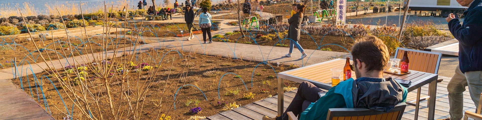 Kawaguchiko Natural Living Center featuring a lake or waterhole and a garden as well as an individual male