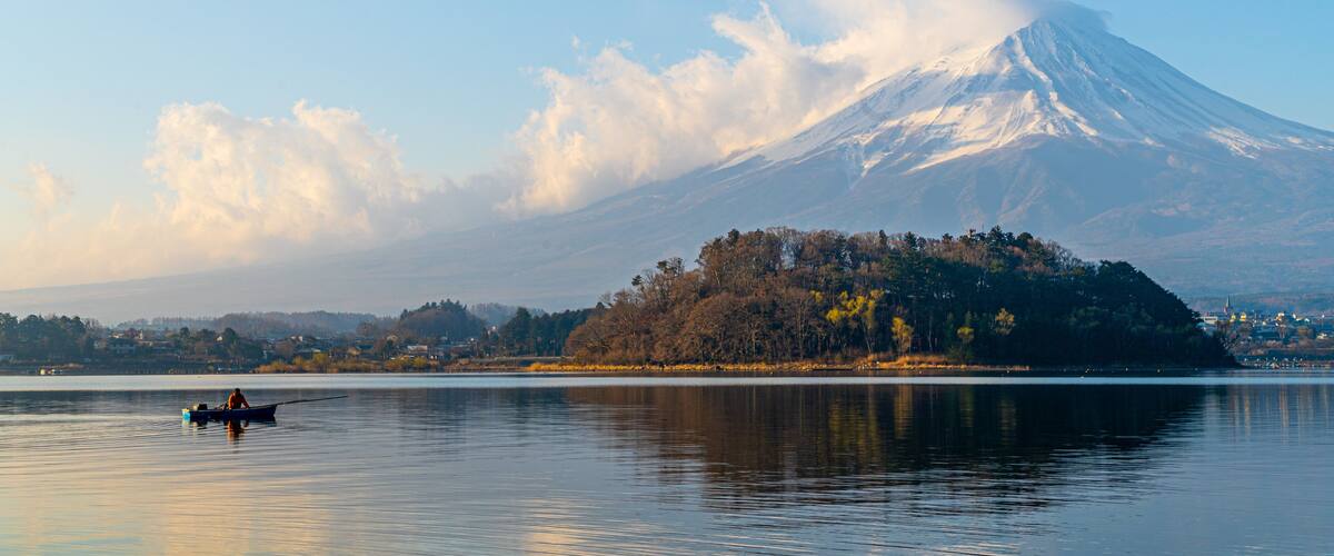 Oishi Park featuring a lake or waterhole, a sunset and mountains