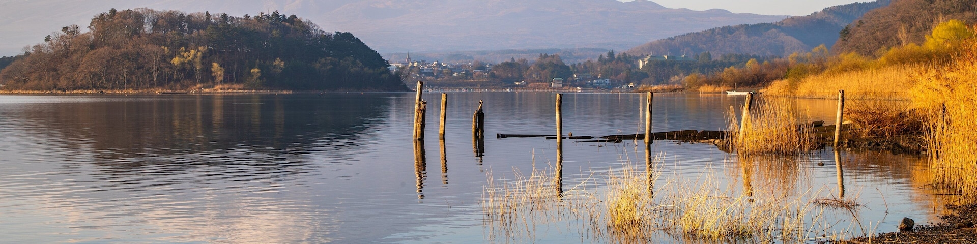 Oishi Park which includes mountains, a lake or waterhole and a sunset