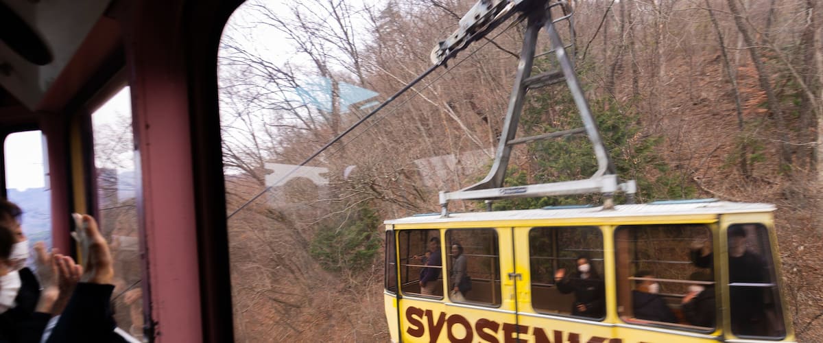 Shosenkyo Ropeway which includes a gondola and signage