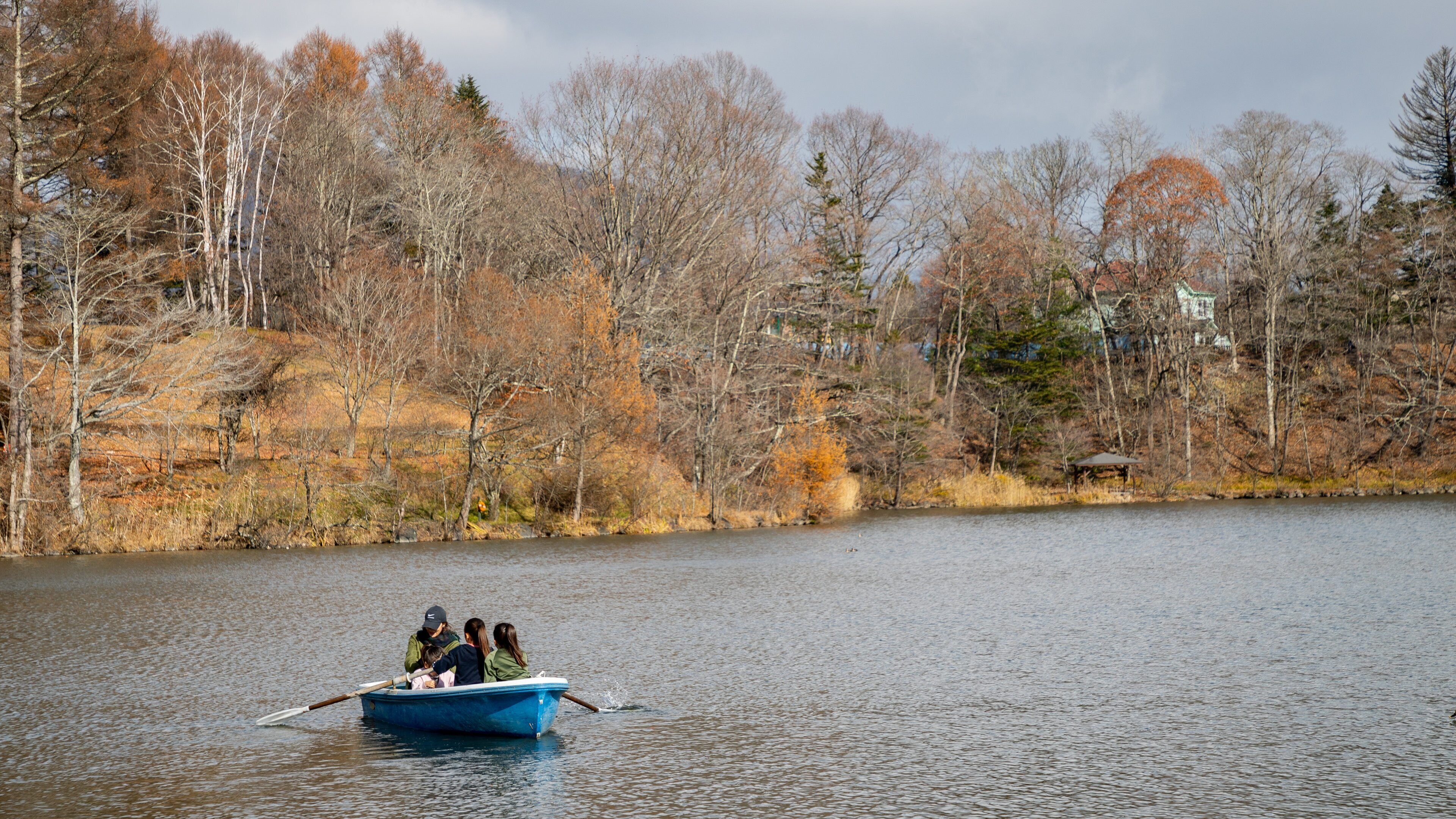 Karuizawa Taliesin featuring a lake or waterhole and boating as well as a small group of people