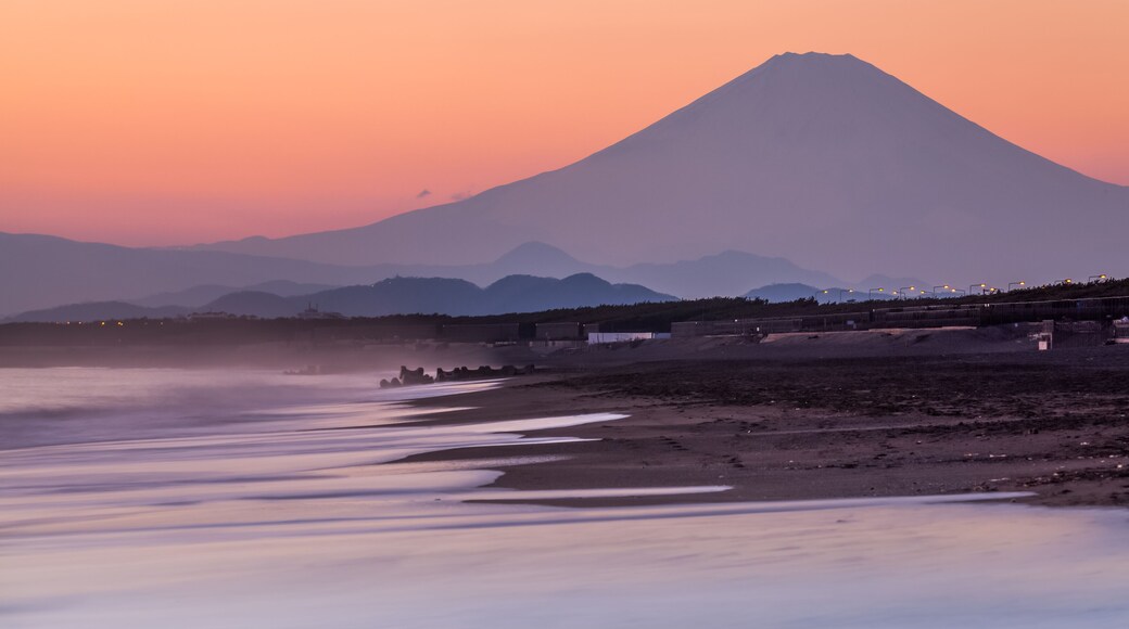 Mountain Fuji and sea wave in sunset at Southern Beach Chigasaki beach , Kanagawa prefecture , Japan