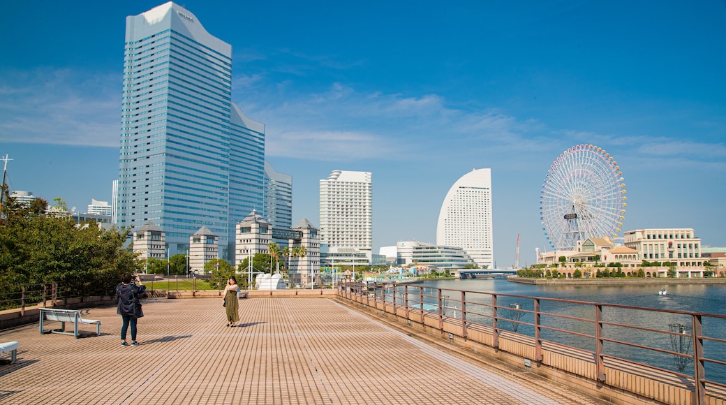 Kishamichi Promenade which includes a bay or harbor and a city as well as a couple