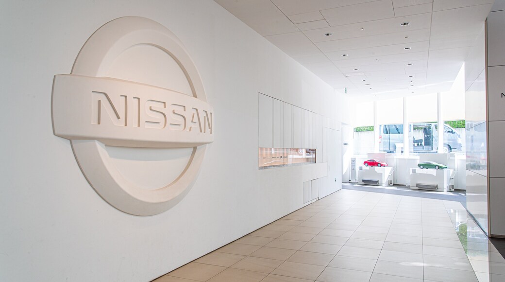 Nissan Global Headquarters Gallery showing interior views and signage