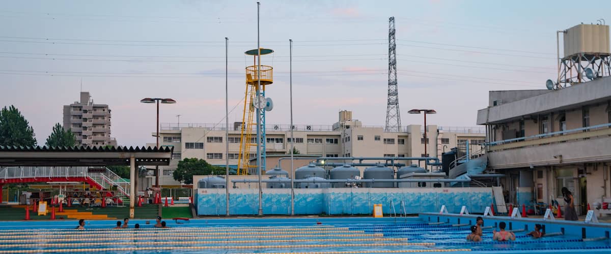 Numakage Park which includes a pool, a sunset and swimming