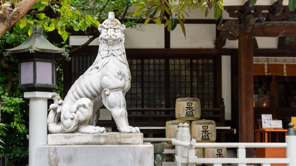 Torigoe Shrine featuring heritage elements and a statue or sculpture