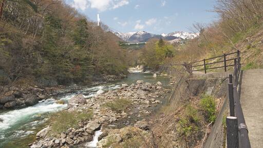 Beautiful Suwakyo Gorge view, Hiking trail by the mountain river in Minakami, springtime, wooden footpath, forest, water flowing, big Suwakyo Bridge