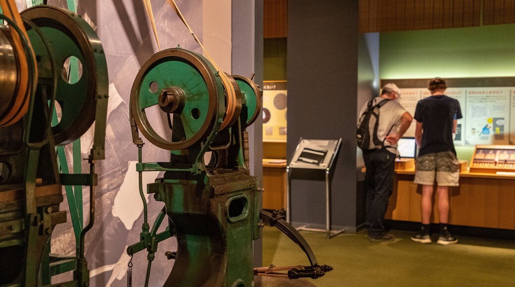 Kanazawa Yasue Gold Leaf Museum featuring interior views as well as a family