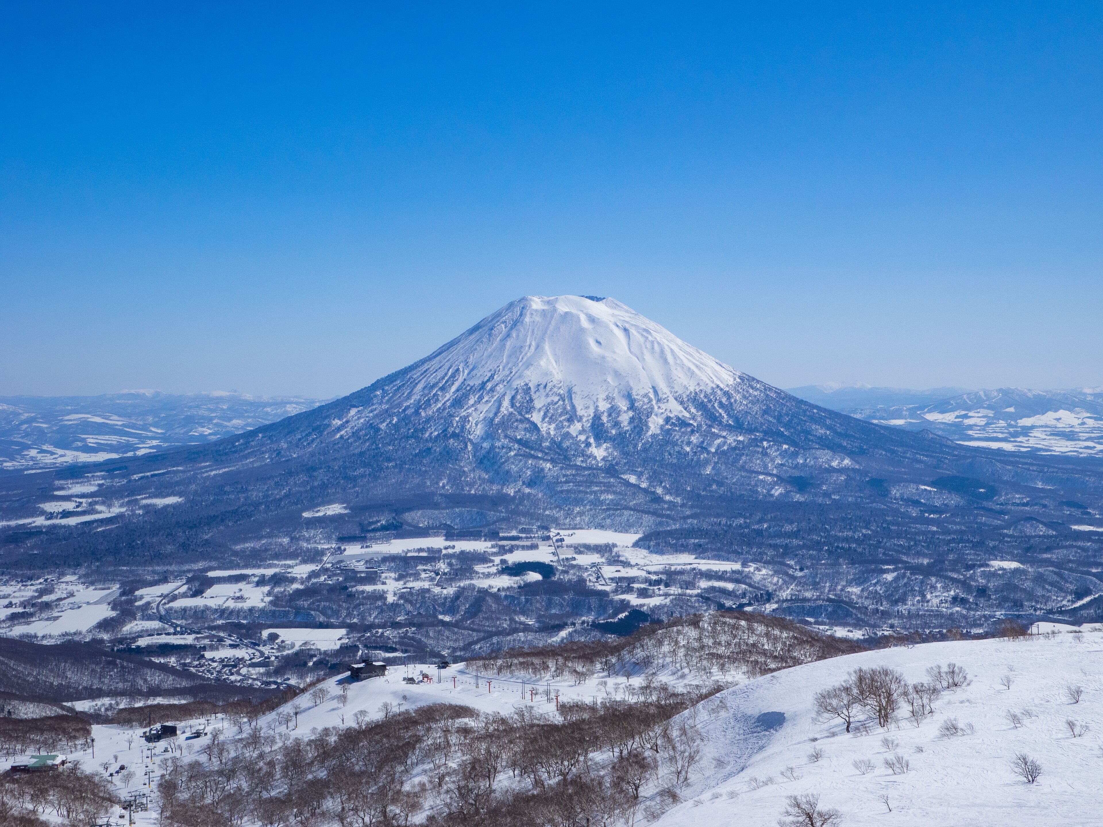 Snowy volcano on a clear day in early spring (Niseko Mt.Resort Grand Hirafu, Hokkaido, Japan)