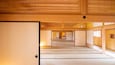 A traditional Japanese interior with tatami flooring, sliding doors, and shoji screens.