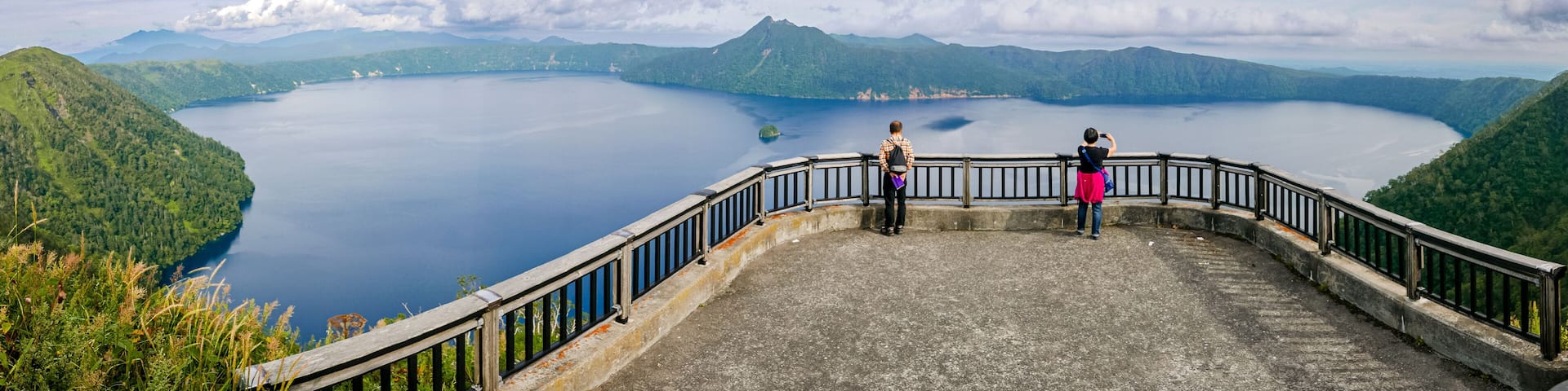 Panoramic view of Lake Mashu from the third observation deck on a late summer afternoon in Teshikaga, eastern Hokkaido, Japan.