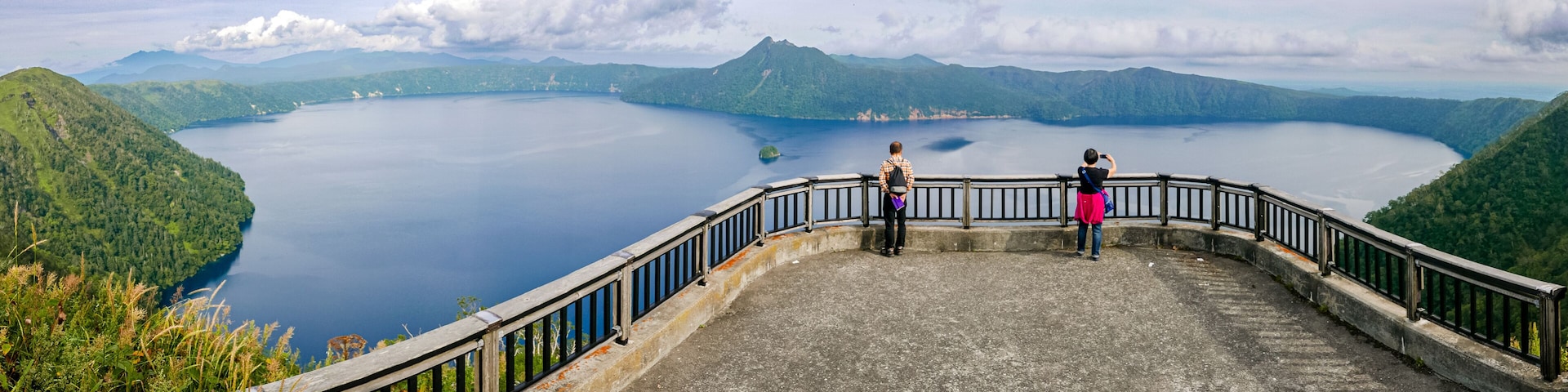 Panoramic view of Lake Mashu from the third observation deck on a late summer afternoon in Teshikaga, eastern Hokkaido, Japan.