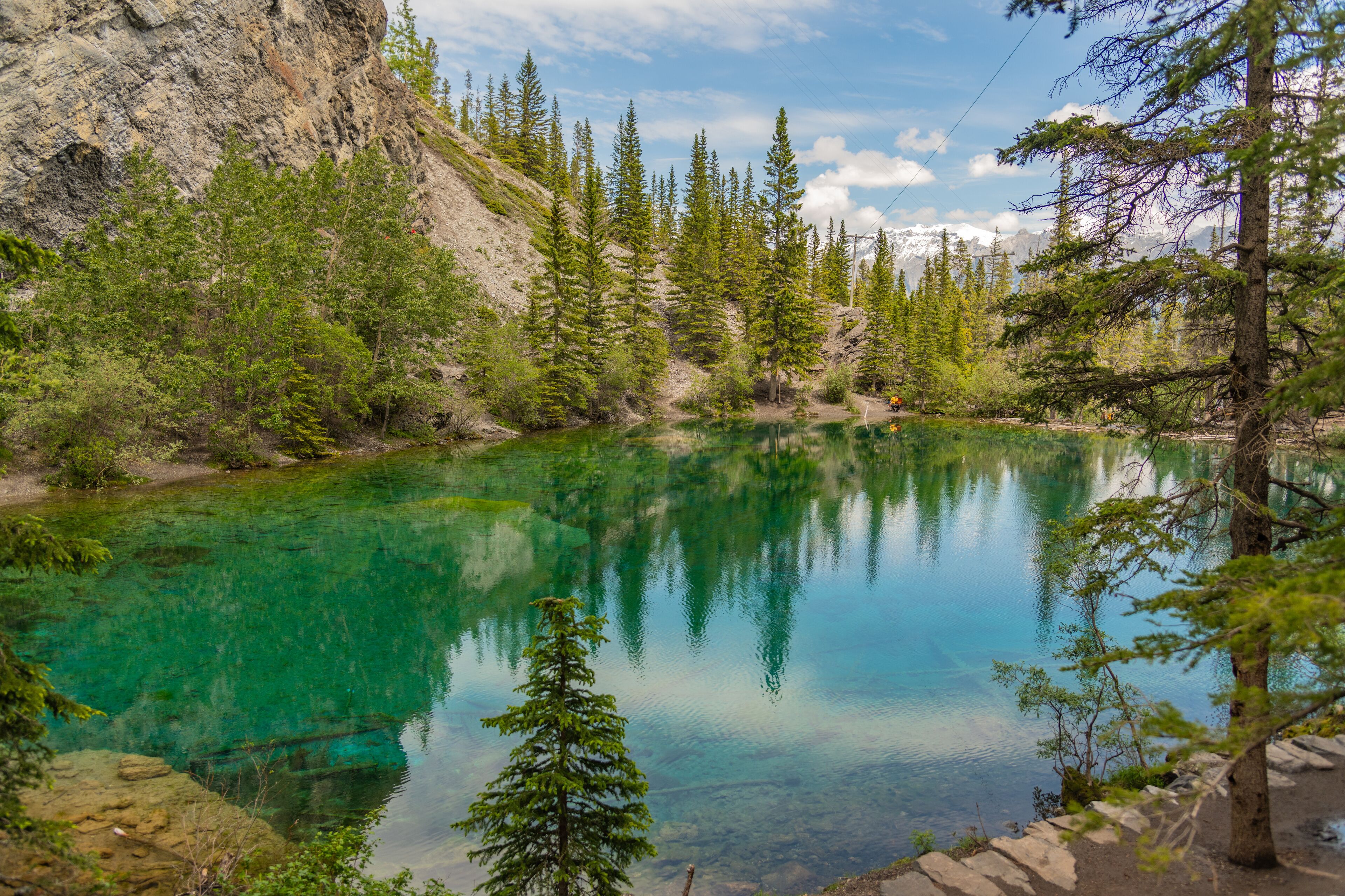 Breathtaking views of the upper and lower Grassi Lakes with brilliant turquoise and aqua waters set in a serene wilderness outside the town of Canmore near Kananaskis during the summer season.