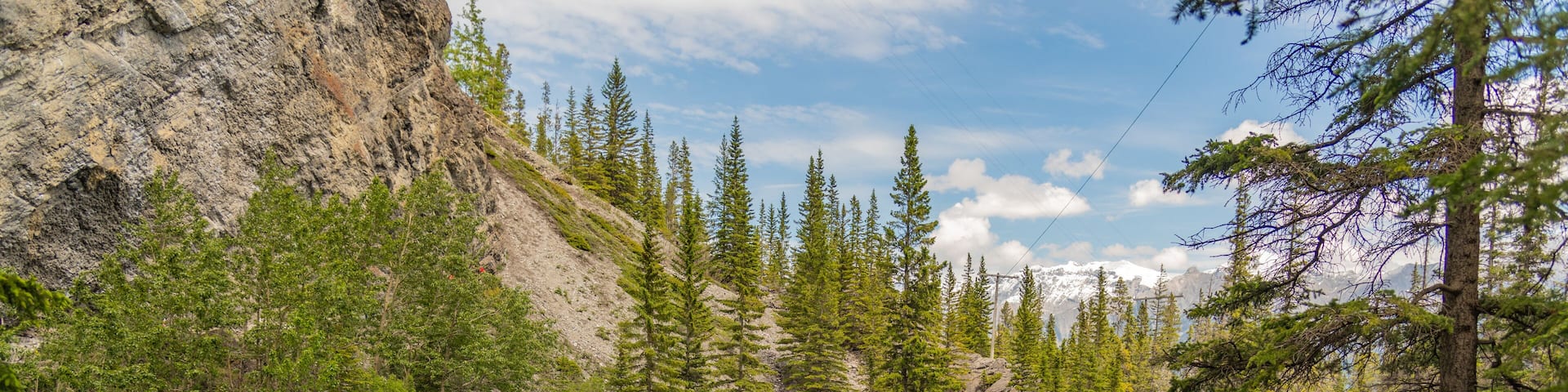 Breathtaking views of the upper and lower Grassi Lakes with brilliant turquoise and aqua waters set in a serene wilderness outside the town of Canmore near Kananaskis during the summer season.
