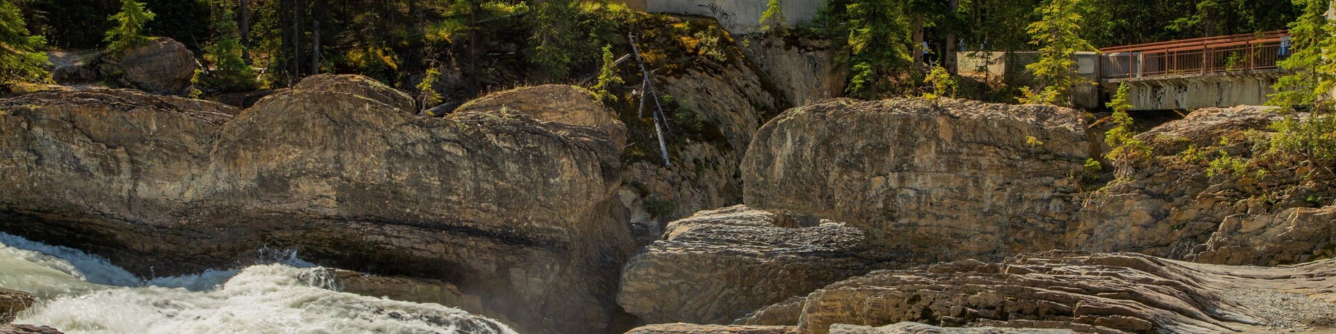 Natural Bridge which includes a river or creek, rapids and a gorge or canyon