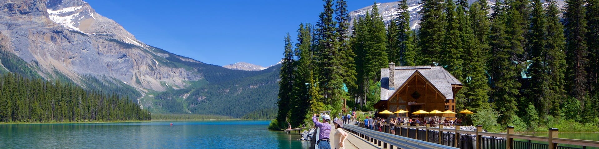 Yoho National Park which includes a lake or waterhole and a bridge as well as a couple