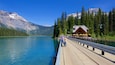 Yoho National Park featuring a lake or waterhole and a bridge as well as a couple