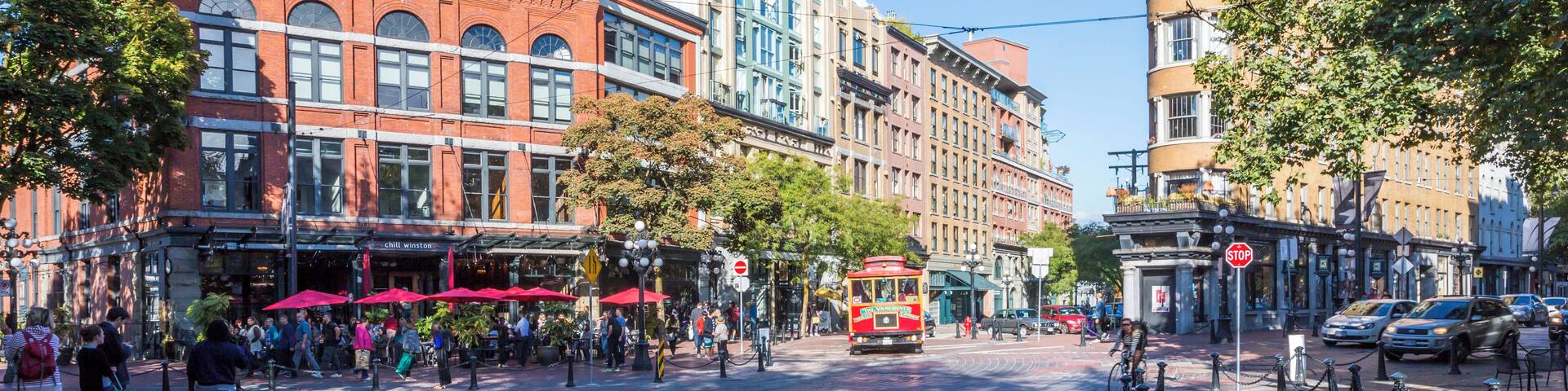 Architecture, trolleybus and cafe bar in Maple Tree Square in Gastown, Vancouver, British Columbia, Canada, North America