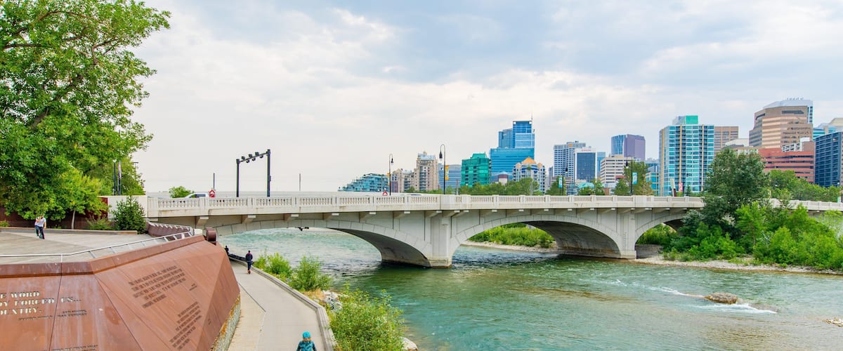 Bow River which includes a bridge, a river or creek and a city
