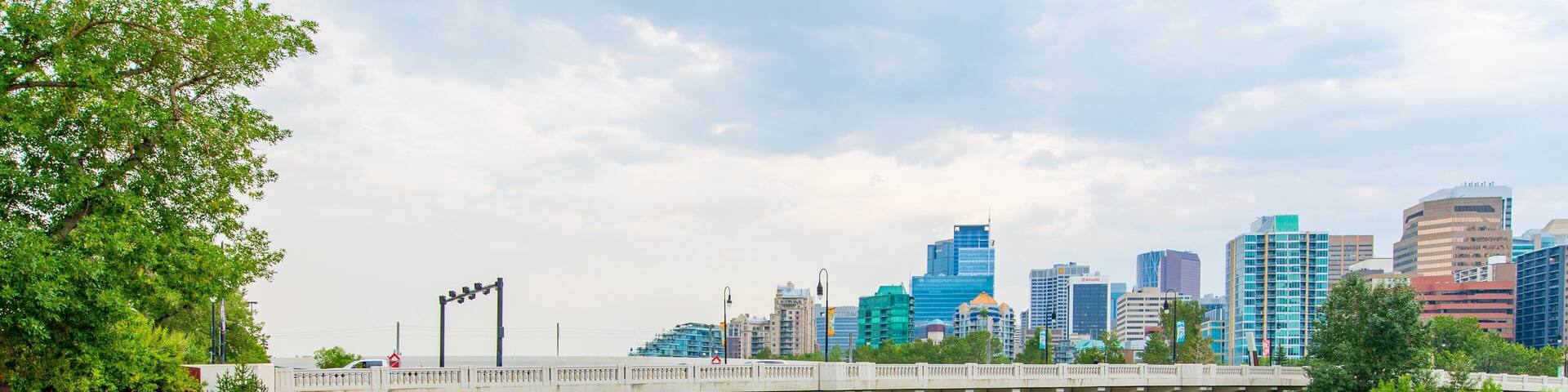 Bow River which includes a bridge, a river or creek and a city