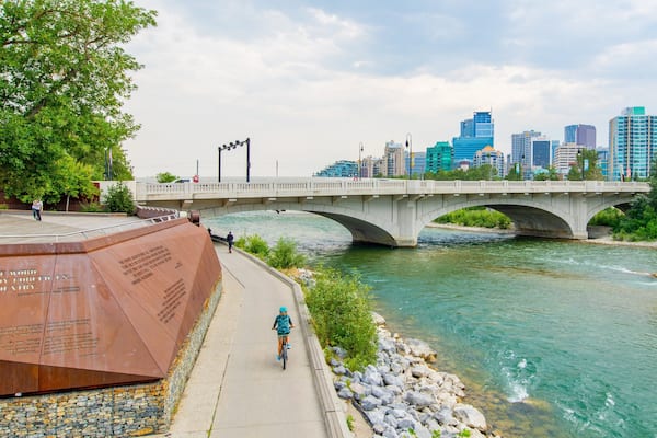 Bow River which includes a bridge, a river or creek and a city