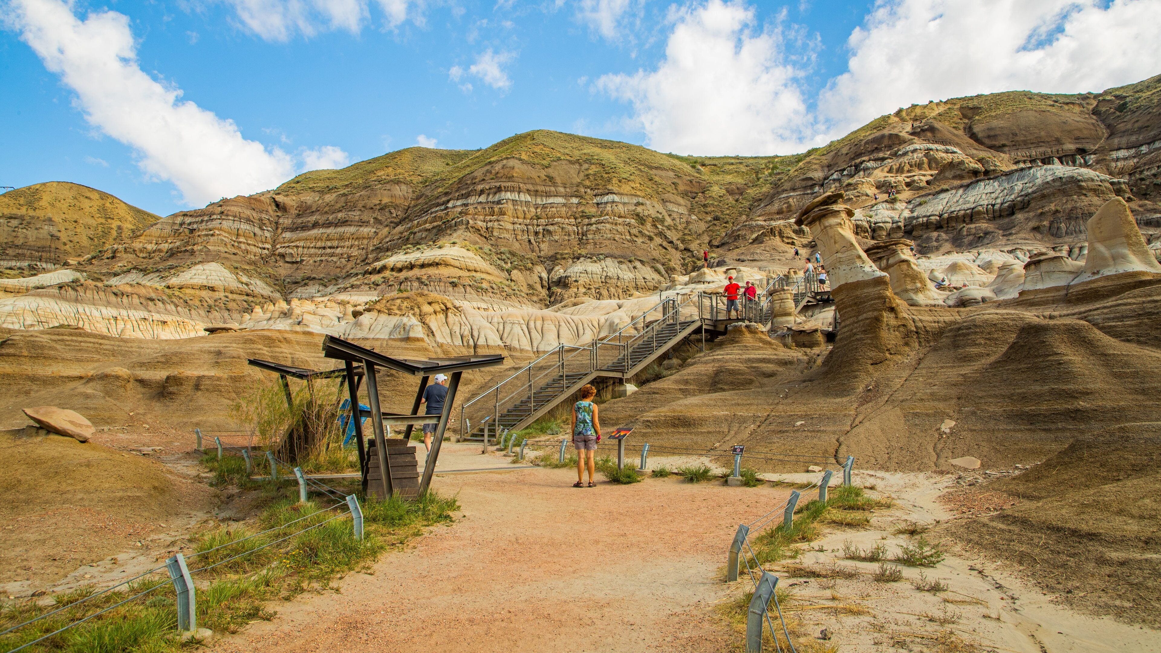 Drumheller Hoodoos showing a gorge or canyon and mountains